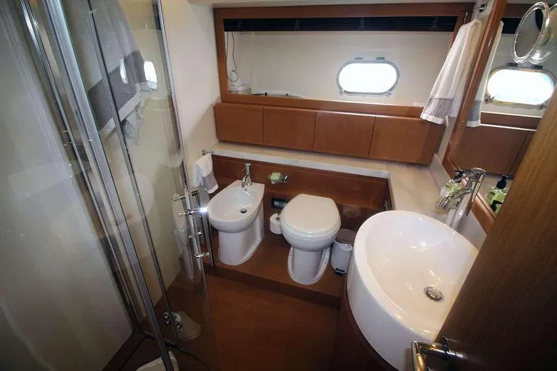  Yacht Photos Pics Luxurious bathroom in a 2006 Ferretti Yachts 780, featuring modern fixtures and elegant design.
