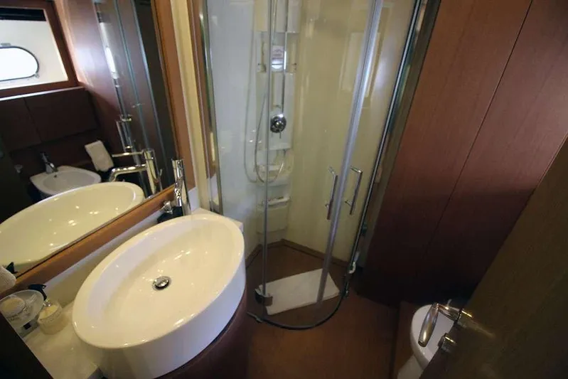  Yacht Photos Pics Luxurious bathroom in 2006 Ferretti Yachts 780 with modern fixtures and glass shower.