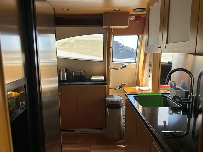  Yacht Photos Pics Luxurious kitchen interior of 2006 Ferretti Yachts 780 with modern appliances and sleek design.
