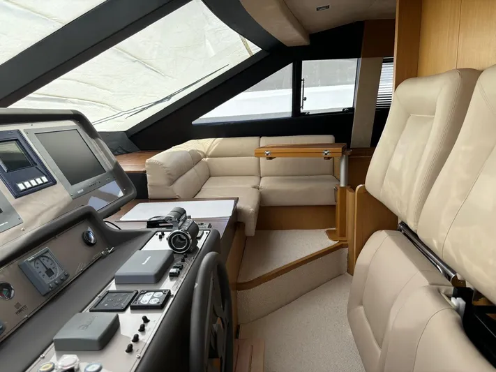  Yacht Photos Pics Luxurious interior of a 2006 Ferretti Yachts 780 with modern helm and seating.