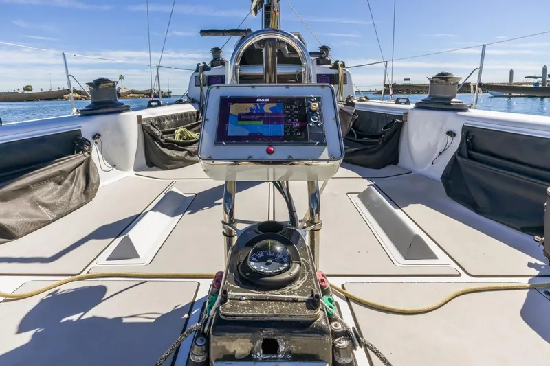 Ground Hog Day Yacht Photos Pics Cockpit view of 2007 Rogers 46 sailboat with navigation equipment and clear sky.