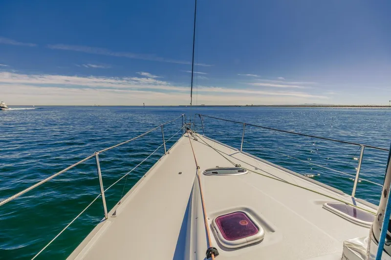 Ground Hog Day Yacht Photos Pics Sailing on a 2007 Rogers 46 yacht under clear blue skies.