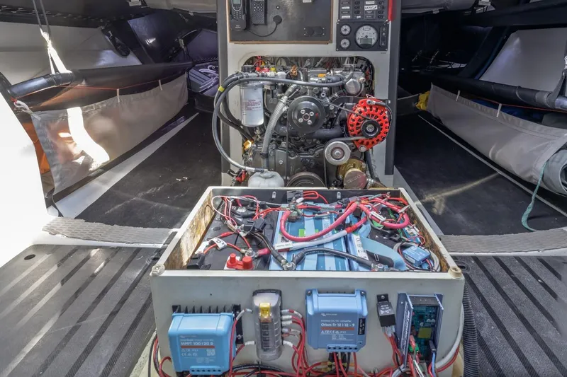 Ground Hog Day Yacht Photos Pics Engine room of a 2007 Rogers 46 yacht, showcasing wiring and mechanical components.