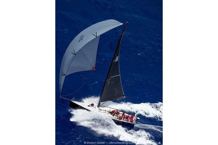 Ground Hog Day Yacht Photos Pics Sailboat Rogers 46, 2007 model, navigating through vibrant blue ocean waves.