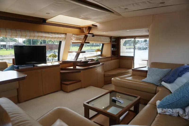 Motor Mile Marine Yacht Photos Pics Luxurious interior of 2008 Ferretti Yachts 630 with leather seating and large windows.
