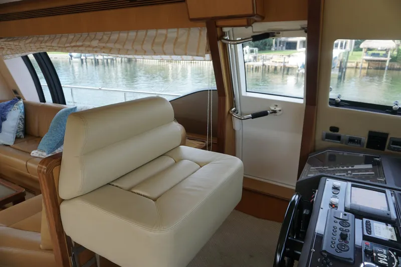 Motor Mile Marine Yacht Photos Pics Luxurious interior of 2008 Ferretti Yachts 630 with plush seating and scenic water view.