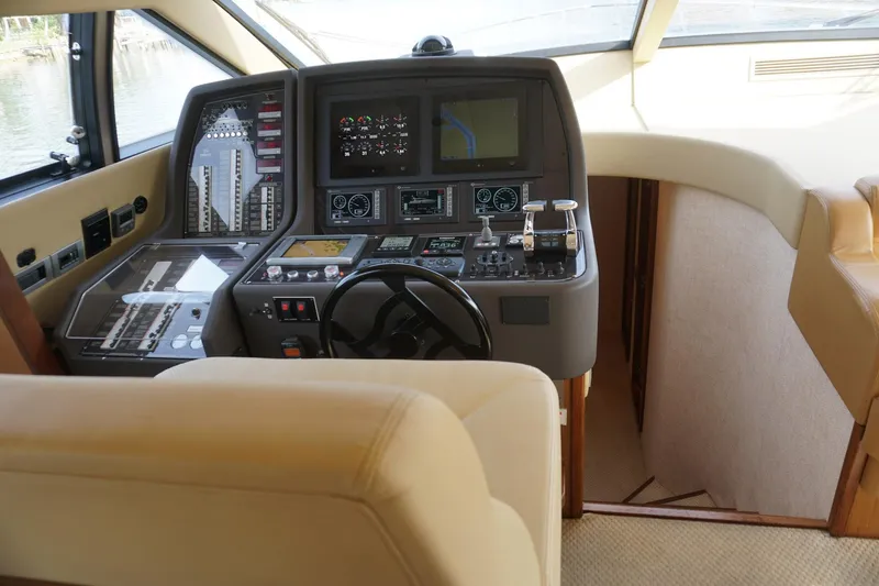 Motor Mile Marine Yacht Photos Pics 2008 Ferretti Yachts 630 helm with advanced navigation controls and luxurious interior design.