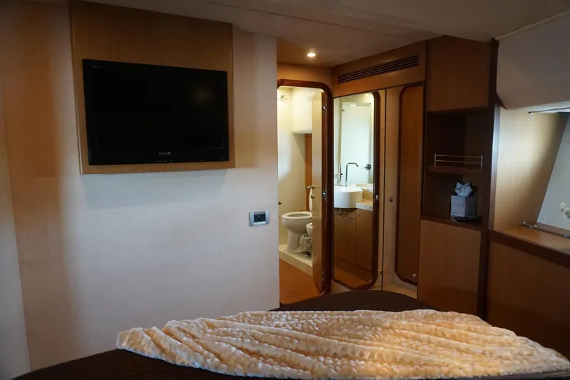 Motor Mile Marine Yacht Photos Pics Luxurious cabin interior of 2008 Ferretti Yachts 630 with ensuite bathroom and TV.