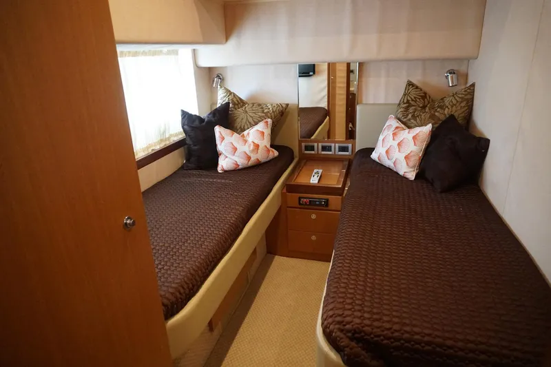 Motor Mile Marine Yacht Photos Pics Luxurious twin cabin in 2008 Ferretti Yachts 630 with elegant bedding and decor.