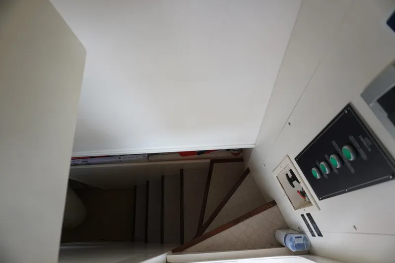 Motor Mile Marine Yacht Photos Pics Staircase inside 2008 Ferretti Yachts 630, featuring control panel and modern design.