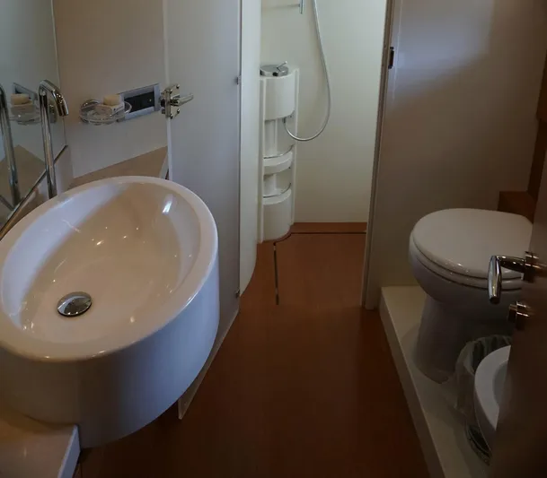Motor Mile Marine Yacht Photos Pics Luxurious bathroom in a 2008 Ferretti Yachts 630, featuring modern fixtures and elegant design.