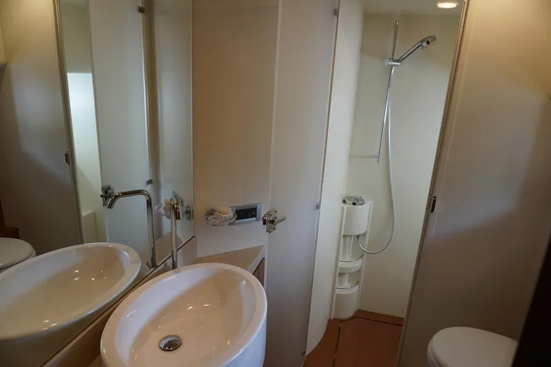 Motor Mile Marine Yacht Photos Pics Luxurious bathroom in 2008 Ferretti Yachts 630, featuring modern sink and shower.