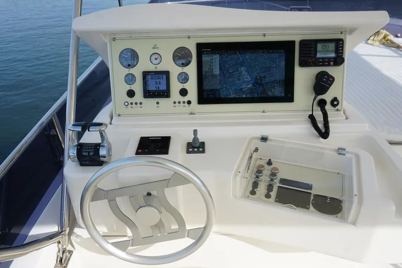 Motor Mile Marine Yacht Photos Pics Control panel of a 2008 Ferretti Yachts 630 with navigation equipment.