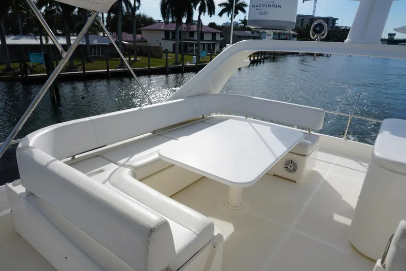 Motor Mile Marine Yacht Photos Pics Luxurious 2008 Ferretti Yachts 630 with elegant white seating and table on deck.