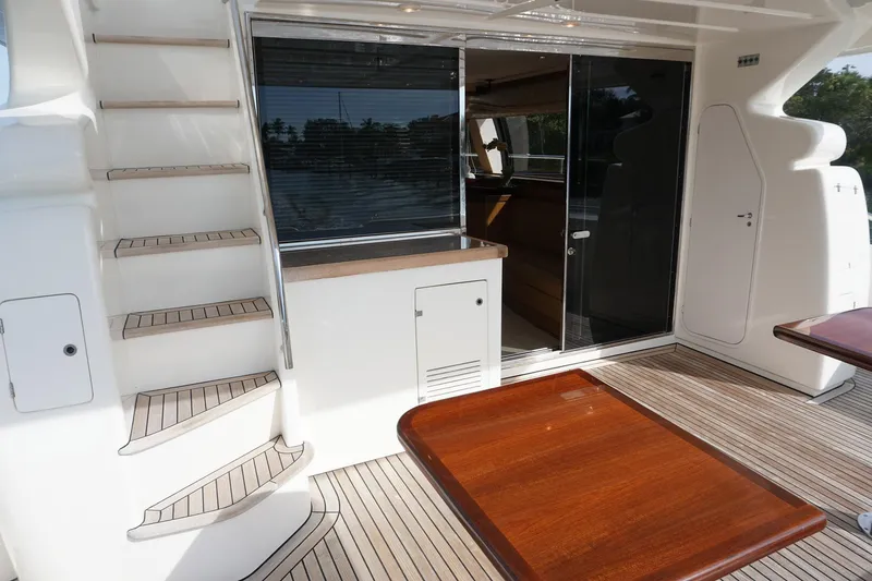 Motor Mile Marine Yacht Photos Pics 2008 Ferretti Yachts 630 aft deck with stairs and sliding glass doors.