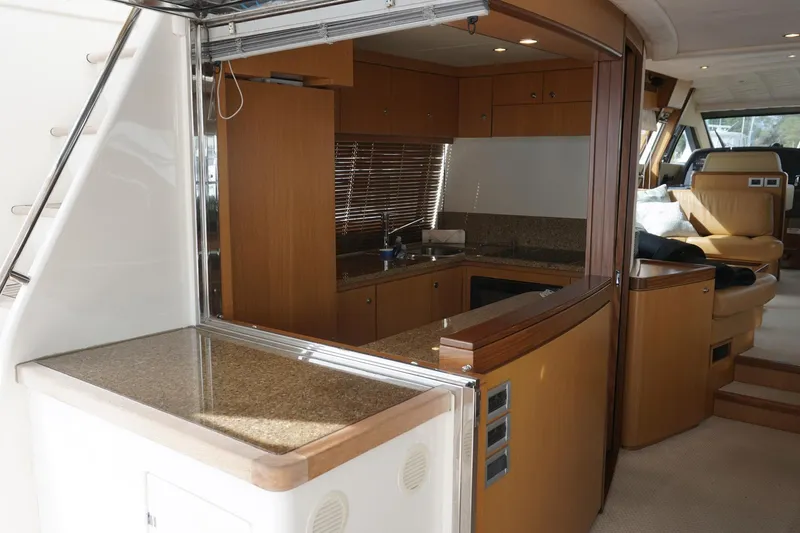 Motor Mile Marine Yacht Photos Pics Interior view of 2008 Ferretti Yachts 630, featuring a modern kitchen and seating area.