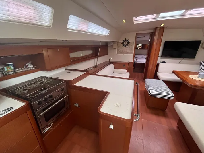 Freedom Yacht Photos Pics Interior of 2011 Beneteau Oceanis 58 yacht with modern kitchen and seating area.
