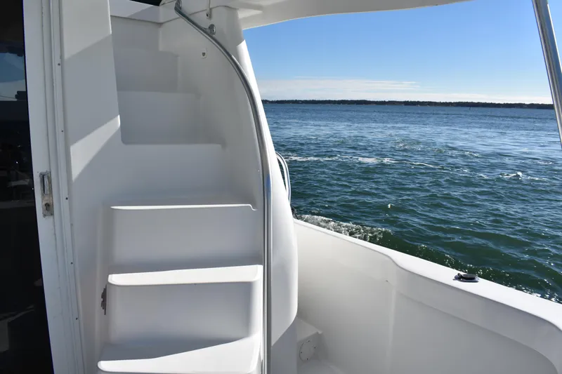  Yacht Photos Pics Staircase on 2001 Mainship 390 yacht with ocean view in background.