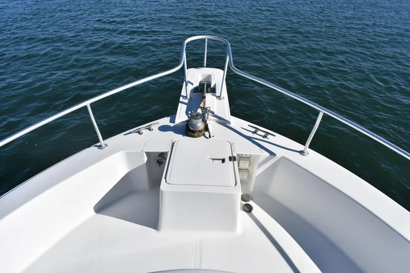  Yacht Photos Pics Bow view of 2001 Mainship 390 boat on calm water.