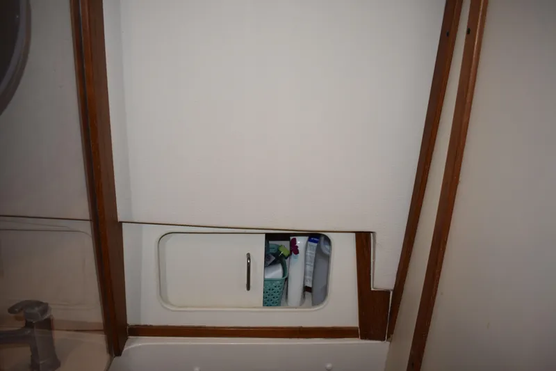 Yacht Photos Pics 2001 Mainship 390 interior storage compartment with toiletries.