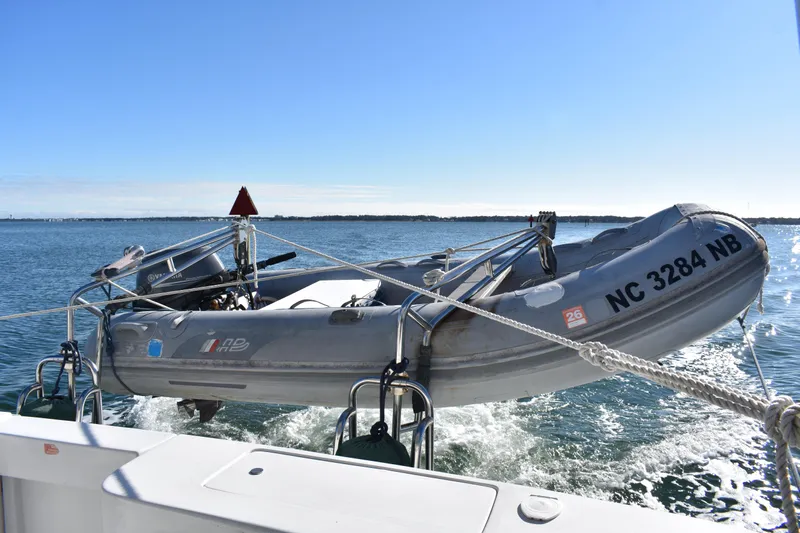  Yacht Photos Pics Inflatable boat on Mainship 390, 2001 model, cruising on open water.