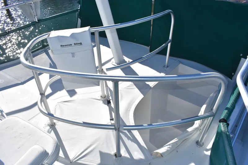  Yacht Photos Pics 2001 Mainship 390 boat deck with rescue sling and safety railings.
