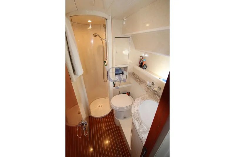  Yacht Photos Pics Luxurious bathroom in 2004 Enterprise Marine 43 FLY yacht with shower and marble countertop.