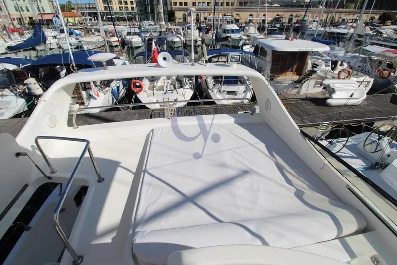  Yacht Photos Pics Flybridge view of 2004 Enterprise Marine 43 FLY yacht in a bustling marina.