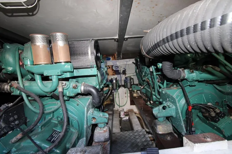  Yacht Photos Pics Engine room of 2004 Enterprise Marine 43 FLY yacht, showcasing dual engines and components.