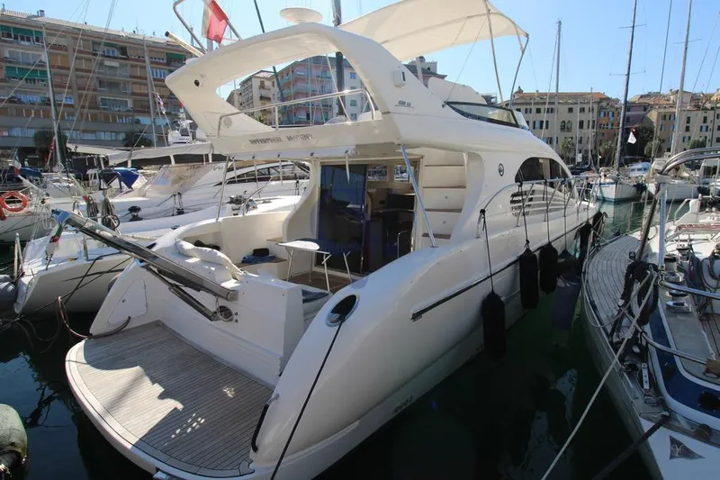  Yacht Photos Pics Luxury 2004 Enterprise Marine 43 FLY yacht docked in a marina.