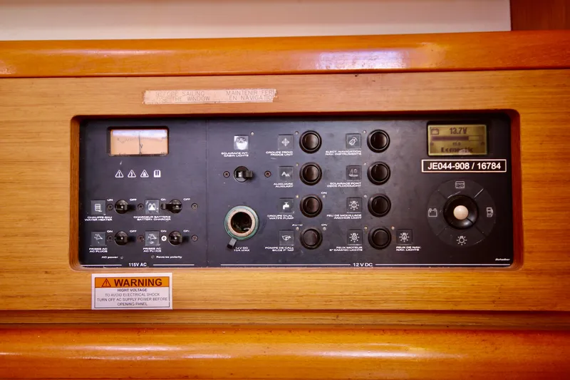 Vela Via Yacht Photos Pics Control panel of a 2009 Jeanneau 44i sailboat, featuring various switches and indicators.