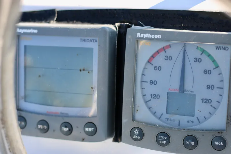 Vela Via Yacht Photos Pics Close-up of Raymarine and Raytheon navigation instruments on a 2009 Jeanneau 44i sailboat.