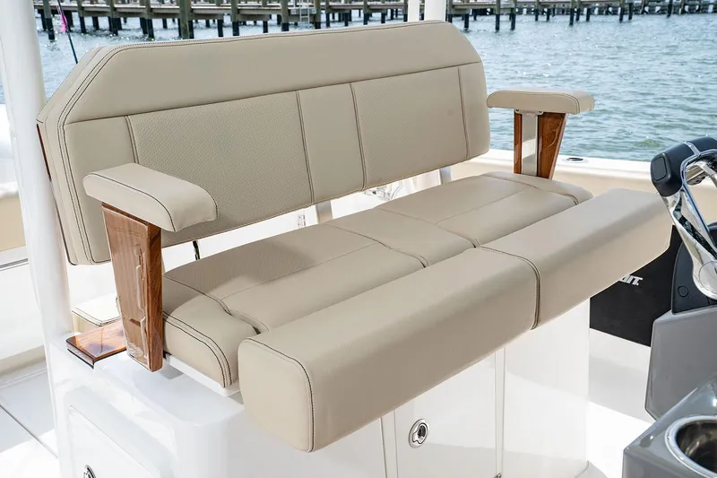  Yacht Photos Pics Manufacturer Provided Image: 2025 Pursuit S 288 Sport boat seating with beige upholstery and wooden armrests.