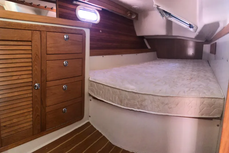 Makani Yacht Photos Pics 2008 Catalina 42 MkII cabin interior with wooden cabinetry and comfortable bed.