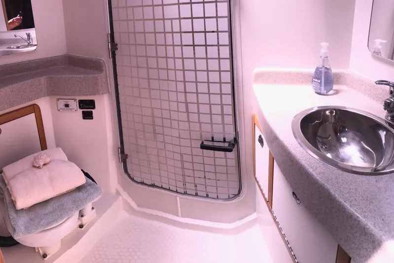 Makani Yacht Photos Pics 2008 Catalina 42 MkII yacht bathroom with sink, toilet, and storage cabinets.