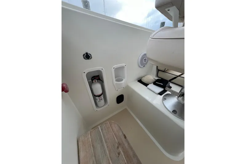 True Love Yacht Photos Pics Interior of 2009 MJM 29z Express boat with fire extinguisher and seating area.