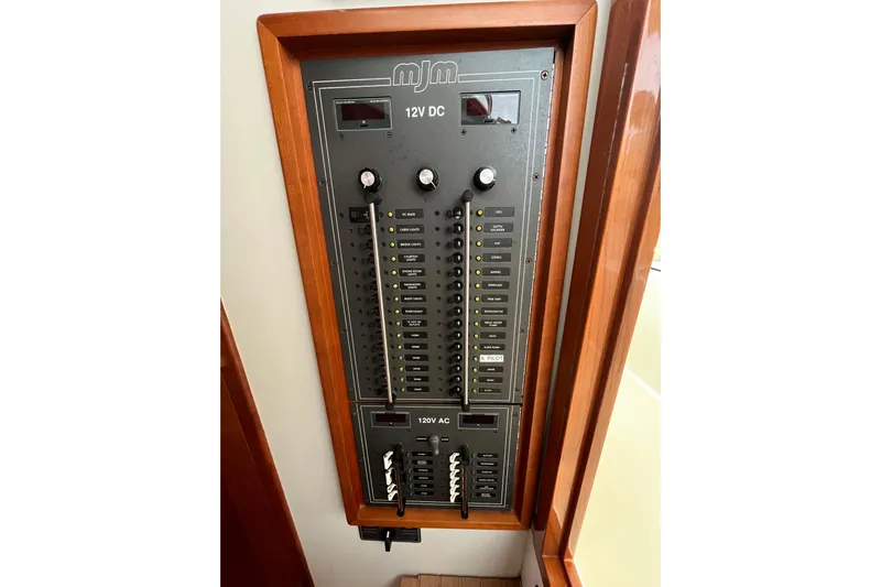 True Love Yacht Photos Pics Electrical panel of 2009 MJM 29z Express boat with 12V DC and 120V AC controls.