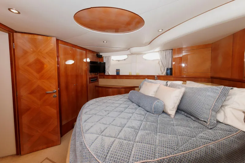 Tool N' Around Yacht Photos Pics Luxurious cabin interior of 2005 Aicon Yachts 56 Flybridge with elegant wood finishes.