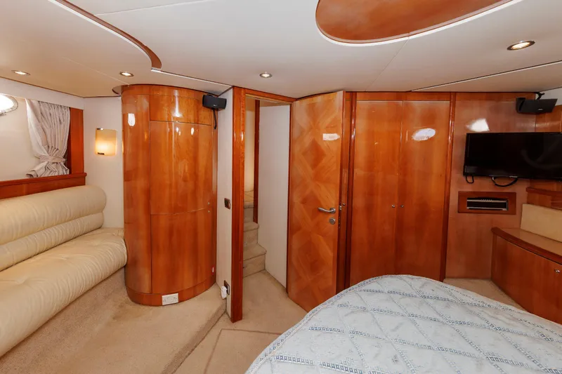 Tool N' Around Yacht Photos Pics Luxurious interior of 2005 Aicon Yachts 56 Flybridge with wood paneling and modern amenities.