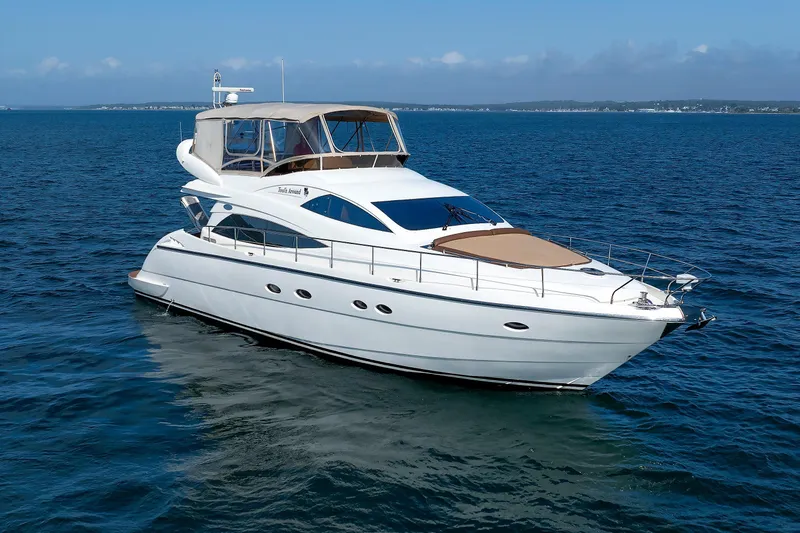 Tool N' Around Yacht Photos Pics Aicon Yachts 56 Flybridge 2005 cruising on open water under clear skies.