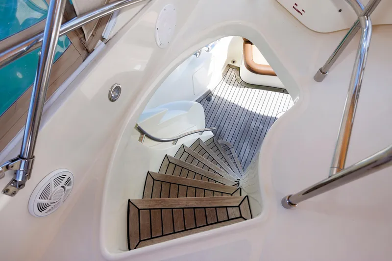 Tool N' Around Yacht Photos Pics Staircase on 2005 Aicon Yachts 56 Flybridge with sleek design and wooden steps.