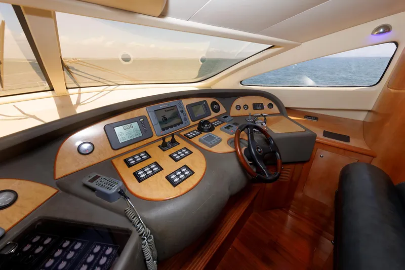 Tool N' Around Yacht Photos Pics Helm of 2005 Aicon Yachts 56 Flybridge with navigation instruments and steering wheel.