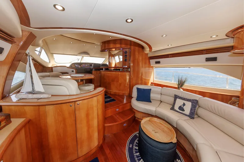 Tool N' Around Yacht Photos Pics Luxurious interior of 2005 Aicon Yachts 56 Flybridge with elegant wood finishes and plush seating.