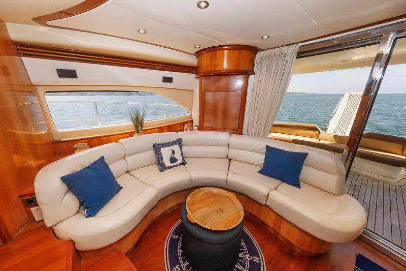 Tool N' Around Yacht Photos Pics Luxurious interior of 2005 Aicon Yachts 56 Flybridge with elegant seating and ocean view.