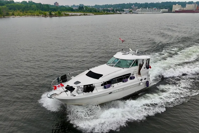 A Mi Manera Yacht Photos Pics 2007 Sea Ray 40 Motor Yacht cruising on a scenic waterway.