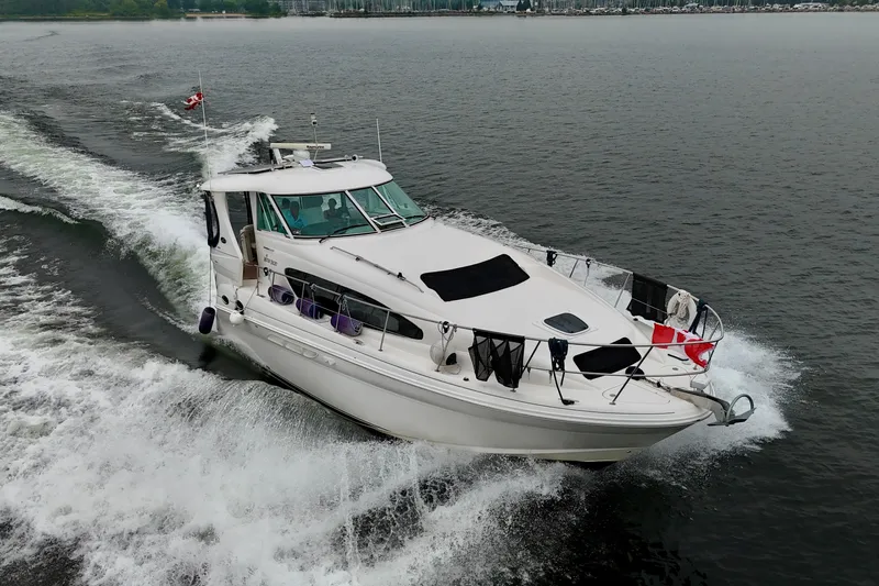 A Mi Manera Yacht Photos Pics 2007 Sea Ray 40 Motor Yacht cruising on open water, displaying sleek design and power.
