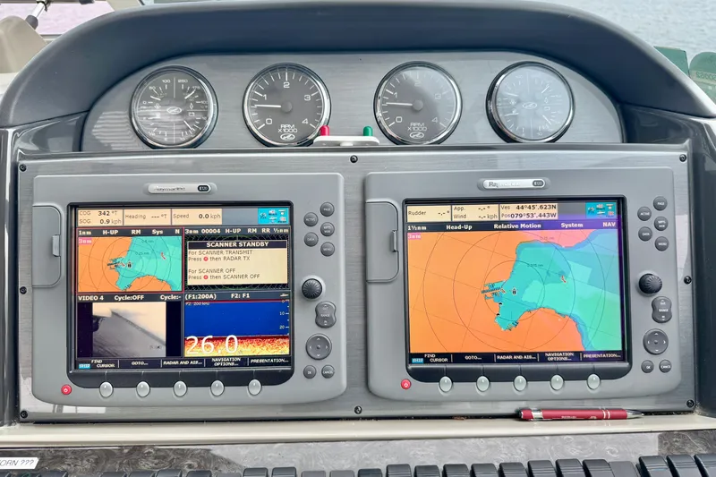 A Mi Manera Yacht Photos Pics Dashboard of a 2007 Sea Ray 40 Motor Yacht with navigation screens and gauges.