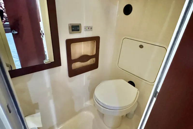 A Mi Manera Yacht Photos Pics 2007 Sea Ray 40 Motor Yacht bathroom interior with toilet and storage compartments.