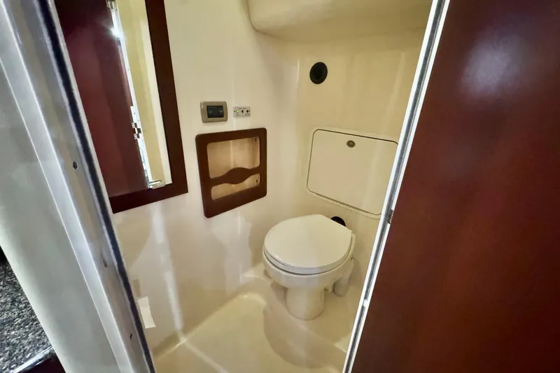A Mi Manera Yacht Photos Pics 2007 Sea Ray 40 Motor Yacht bathroom with toilet and storage compartment.