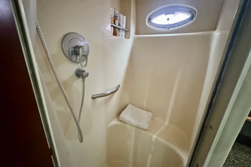 A Mi Manera Yacht Photos Pics Shower area in 2007 Sea Ray 40 Motor Yacht with porthole and toiletries.